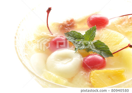 Shooting a fruit punch with various fruits and white balls on a white background 80940580