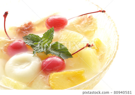 Shooting a fruit punch with various fruits and white balls on a white background 80940581