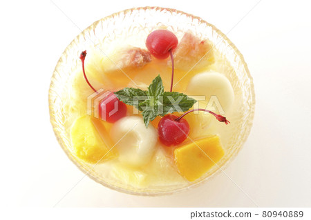 A bird's-eye view of a fruit punch containing various fruits and white balls on a white background A bird's-eye view of a fruit punch containing various fruits and white balls on a white background 80940889