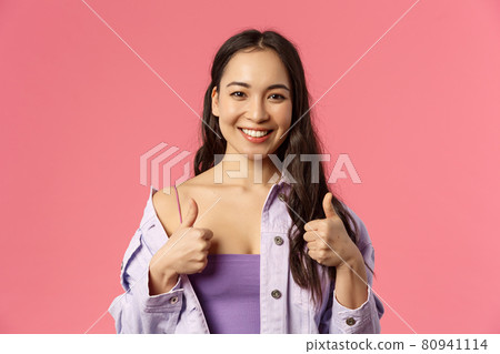 Sounds good Im in. Close-up portrait of satisfied, excited smiling beautiful asian girl in stylish outfit, recommend product, pleased with service or company, show thumbs-up, like and approve Sounds good Im in. Close-up portrait of satisfied, excited smiling beautiful asian girl in stylish outfit, recommend product, pleased with service or company, show thumbs-up, like and approve 80941114