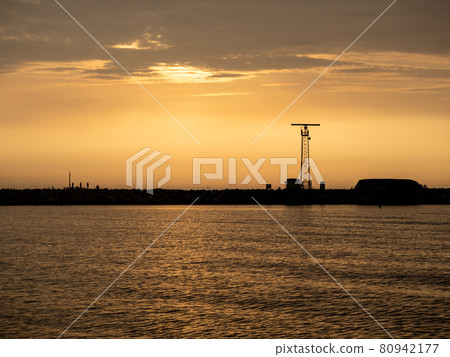 View of the harbor wall with anglers 80942177