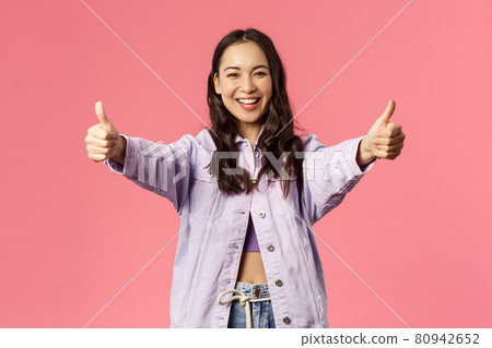 Totally agree. Portrait of cheerful young woman in denim jacket approve awesome, super cool idea, show thumbs-up and smiling happy, cheering, rooting or encourage do it, like plan, pink background Totally agree. Portrait of cheerful young woman in denim jacket approve awesome, super cool idea, show thumbs-up and smiling happy, cheering, rooting or encourage do it, like plan, pink background 80942652