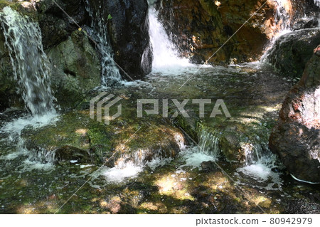 Rocks and water flow in Japanese garden and swan garden 80942979