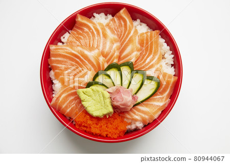 Salmon don, fresh raw salmon and salmon roes over rice in a bowl on white background. Salmon don, fresh raw salmon and salmon roes over rice in a bowl on white background. 80944067