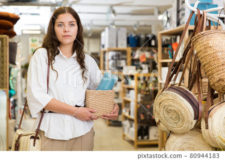 Woman shopping at store of household goods Woman shopping at store of household goods 80944183