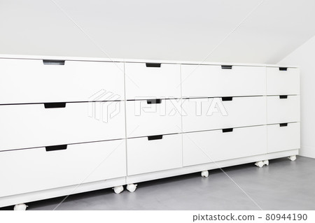 Modern Drawer cabinet with plenty of storage space in a room of a house. Copy space 80944190