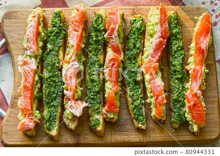 italian cuisine bruschetta with pesto and salmon with cream cheese and garlic italian cuisine bruschetta with pesto and salmon with cream cheese and garlic 80944331