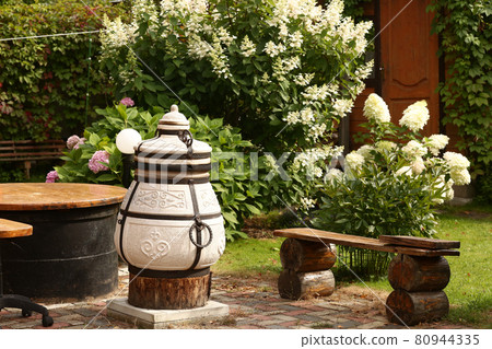 beautiful formal garden with dining place, table tandoor bench beautiful formal garden with dining place, table tandoor bench 80944335