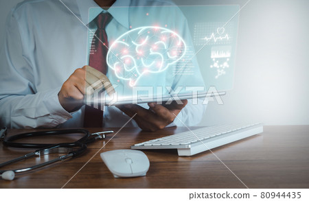 Doctor using tablet technology for research and analysis brain. Digital healthcare and network connection on hologram modern virtual screen interface, medical and futuristic concept in hospital. Doctor using tablet technology for research and analysis brain. Digital healthcare and network connection on hologram modern virtual screen interface, medical and futuristic concept in hospital. 80944435