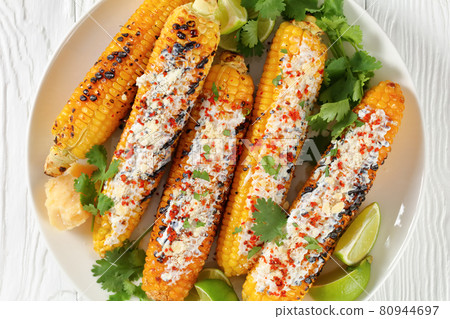 Elote, Grilled Mexican Street Corn on a plate Elote, Grilled Mexican Street Corn on a plate 80944697