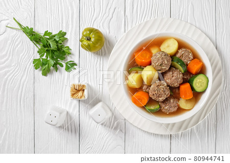 hot mexican meatball vegetable soup, top view 80944741