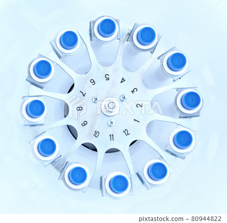 Blood centrifuge. Platelet-Rich plasma preparation. Tubes with blood in Centrifuge. Blue tonned image Blood centrifuge. Platelet-Rich plasma preparation. Tubes with blood in Centrifuge. Blue tonned image 80944822