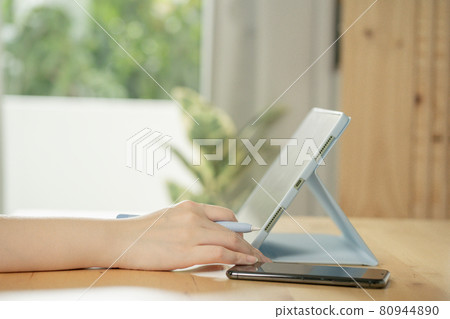 closeup woman hand use tablet meeting and working from home closeup woman hand use tablet meeting and working from home 80944890