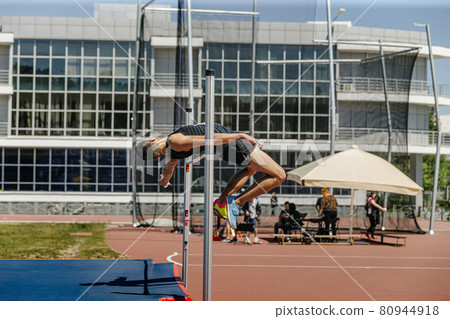 high jump male athlete successful attempt at competition high jump male athlete successful attempt at competition 80944918