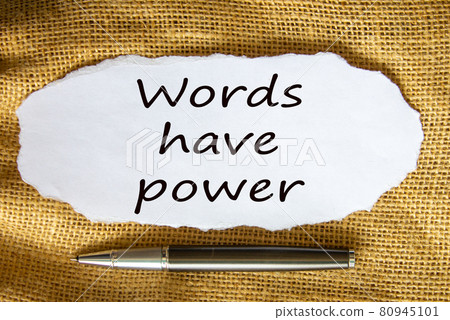 The text 'words have power' on white paper. Metalic pen. Beautiful canvas background. Business concept. The text 'words have power' on white paper. Metalic pen. Beautiful canvas background. Business concept. 80945101