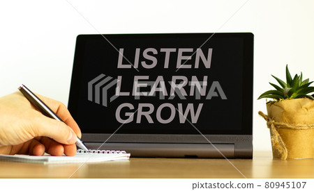 Listen, learn, grow symbol. Tablet with words 'Listen, learn, grow'. Businessman holds pen, house plant. Beautiful white background. Business, educational and Listen, learn, grow concept, copy space. Listen, learn, grow symbol. Tablet with words 'Listen, learn, grow'. Businessman holds pen, house plant. Beautiful white background. Business, educational and Listen, learn, grow concept, copy space. 80945107
