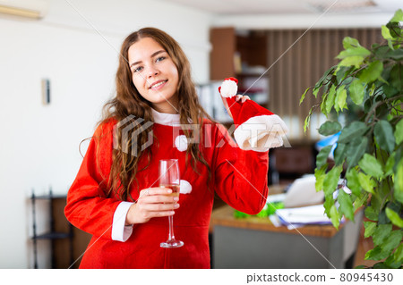 Businesswoman celebrating New Year in office Businesswoman celebrating New Year in office 80945430