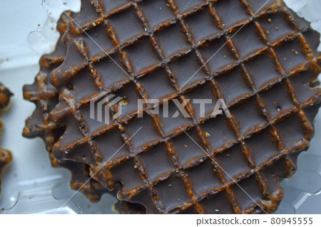 Chocolate round waffle cookies on a white background Chocolate round waffle cookies on a white background 80945555