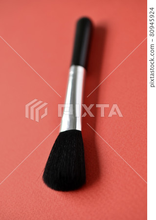 Brush for cleaning optics on a red background Brush for cleaning optics on a red background 80945924