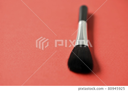 Brush for cleaning optics on a red background Brush for cleaning optics on a red background 80945925