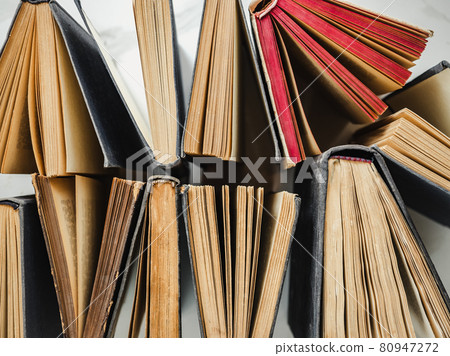 Stack of vintage books lying on the table Stack of vintage books lying on the table 80947272