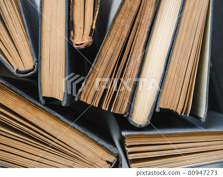 Stack of vintage books lying on the table Stack of vintage books lying on the table 80947273