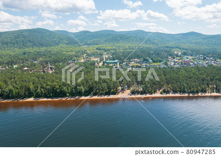 Summertime imagery of Lake Baikal is a rift lake located in southern Siberia, Russia Baikal lake summer landscape view from a cliff near Grandma's Bay. Drone's Eye View. Summertime imagery of Lake Baikal is a rift lake located in southern Siberia, Russia Baikal lake summer landscape view from a cliff near Grandma's Bay. Drone's Eye View. 80947285