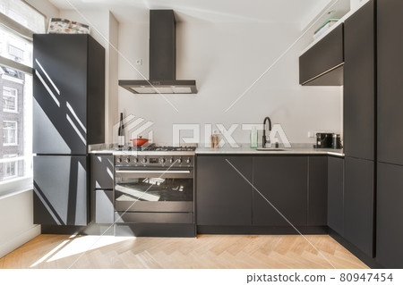 Interior of a beautiful kitchen of an elite house Interior of a beautiful kitchen of an elite house 80947454