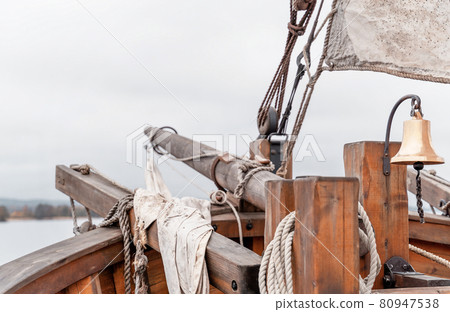 Wooden old ship in vintage style with all sails set in misty lake. Moody background. 80947538