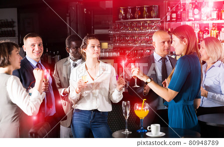 Two young women drinking cocktails Two young women drinking cocktails 80948789