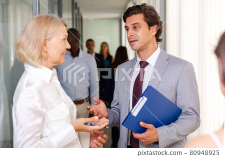 Office workers having conversation Office workers having conversation 80948925