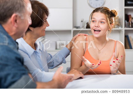 Happy family is talking about life at the table Happy family is talking about life at the table 80948953