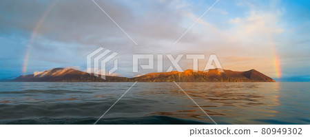 Beautiful panorama with a rainbow over the sea and the coast. Beautiful panorama with a rainbow over the sea and the coast. 80949302