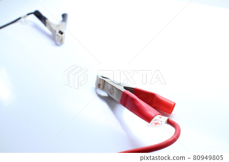 Facing red and black booster cables Facing red and black booster cables 80949805