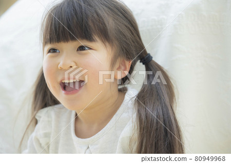 Girl playing wrapped in sheets 80949968