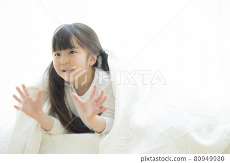 Girl playing wrapped in sheets 80949980