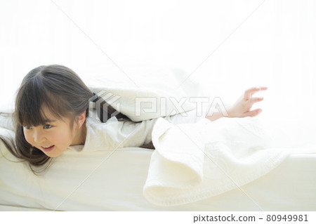 Girl playing wrapped in sheets 80949981
