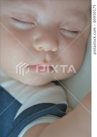 Baby's cute sleeping face 80950175