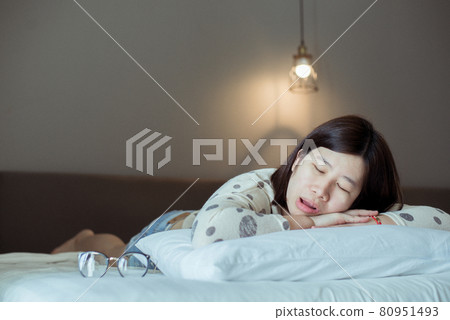 Asian women snoring because due to tired,Female snor while sleeping open your mouth in bedroom 80951493