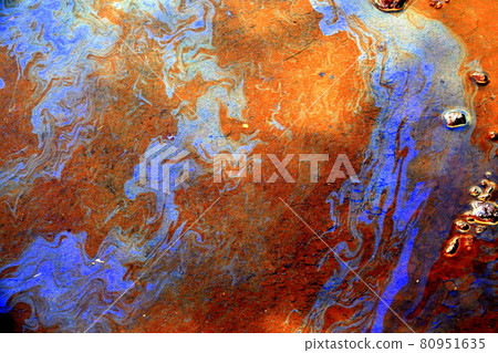 Oil film of oil flowing from a recycling factory 80951635