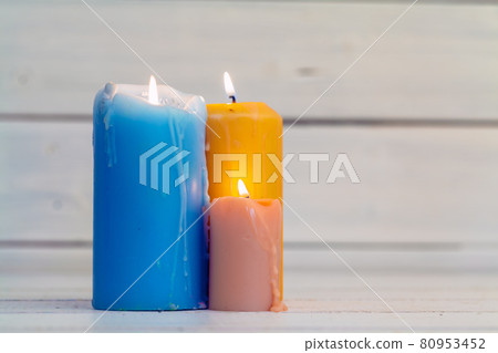 home lighting candles on wooden table 80953452
