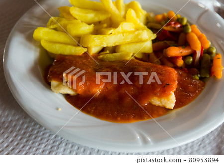 Filet of cod fish in tomato sauce Filet of cod fish in tomato sauce 80953894