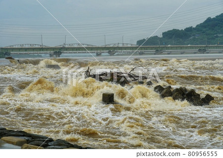 Water overflows due to flooding of rivers due to heavy rain 80956555