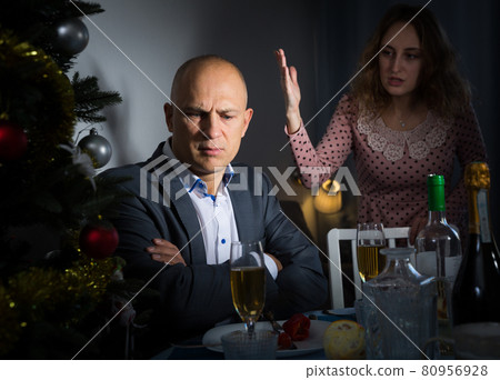 Couple quarreling at Christmas night Couple quarreling at Christmas night 80956928