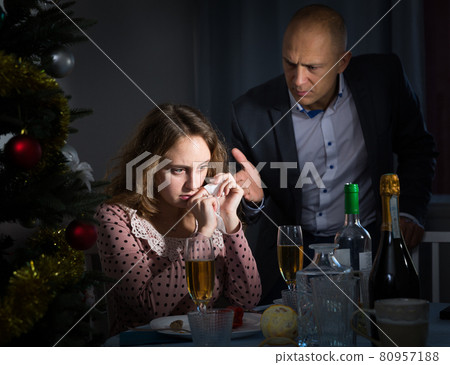 Couple quarreling at Christmas night Couple quarreling at Christmas night 80957188