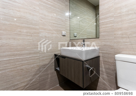 Modern wash basin in new bathroom interior in Spacious apartment Modern wash basin in new bathroom interior in Spacious apartment 80958698