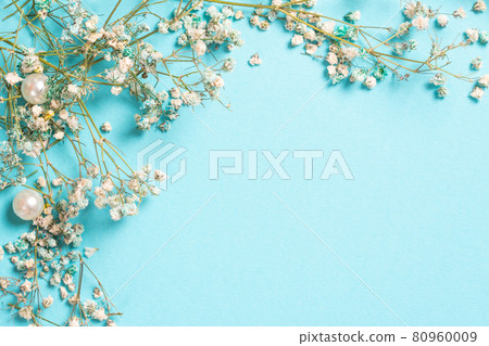 Floral composition with tiny Gypsophila flowers on pastel blue background. Flat lay, top view, copy space Floral composition with tiny Gypsophila flowers on pastel blue background. Flat lay, top view, copy space 80960009