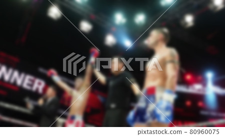 Thai Kick boxing. Blurred images of Muay Thai. Martial Art Kickboxing. Local and foriegn boxer are fighting on the ring at indoor stadium stage. Muaythai is sport competition for traveller sightseeing Thai Kick boxing. Blurred images of Muay Thai. Martial Art Kickboxing. Local and foriegn boxer are fighting on the ring at indoor stadium stage. Muaythai is sport competition for traveller sightseeing 80960075