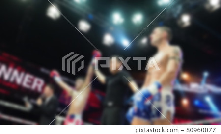 Thai Kick boxing. Blurred images of Muay Thai. Martial Art Kickboxing. Local and foriegn boxer are fighting on the ring at indoor stadium stage. Muaythai is sport competition for traveller sightseeing Thai Kick boxing. Blurred images of Muay Thai. Martial Art Kickboxing. Local and foriegn boxer are fighting on the ring at indoor stadium stage. Muaythai is sport competition for traveller sightseeing 80960077