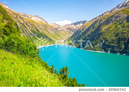 Vivid blue mountain lake in summer Alps Vivid blue mountain lake in summer Alps 80960342